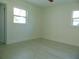 Spacious bedroom with hardwood floors and bright windows at 10322 N Oakleaf Ave, Tampa, FL 33612