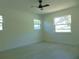 Bright bedroom featuring hardwood floors and ceiling fan at 10322 N Oakleaf Ave, Tampa, FL 33612