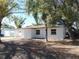 Newly renovated single story home with white brick facade at 10322 N Oakleaf Ave, Tampa, FL 33612