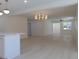 Bright living room with hardwood floors and elegant chandelier at 10322 N Oakleaf Ave, Tampa, FL 33612