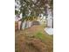 Backyard with a shed and overgrown grass at 13225 2Nd E St, Madeira Beach, FL 33708