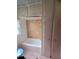 Simple bathroom with a shower/tub and built-in shelving at 13225 2Nd E St, Madeira Beach, FL 33708