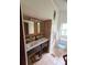 Bathroom with double vanity and tiled floors and walls at 13225 2Nd E St, Madeira Beach, FL 33708