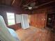 Simple bedroom with hardwood floors and twin bed at 13225 2Nd E St, Madeira Beach, FL 33708