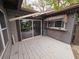 White wooden deck with sliding glass doors at 13225 2Nd E St, Madeira Beach, FL 33708