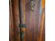 Close-up of rustic wooden door with unique hardware at 13225 2Nd E St, Madeira Beach, FL 33708