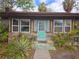 Home exterior featuring a teal front door at 13225 2Nd E St, Madeira Beach, FL 33708