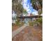 Quaint house with teal door and stone facade at 13225 2Nd E St, Madeira Beach, FL 33708
