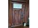 Intricate wood door with a unique etched glass panel at 13225 2Nd E St, Madeira Beach, FL 33708