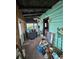 Rustic front porch with wooden ceiling and vintage details at 13225 2Nd E St, Madeira Beach, FL 33708