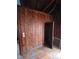 Hallway with rustic wood walls and a closet at 13225 2Nd E St, Madeira Beach, FL 33708