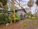 Side view of a gray house with a deck at 13225 2Nd E St, Madeira Beach, FL 33708