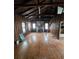 Large living area with hardwood floors and stone fireplace at 13225 2Nd E St, Madeira Beach, FL 33708