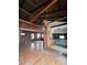 Spacious living room with exposed wooden beams and hardwood floors at 13225 2Nd E St, Madeira Beach, FL 33708