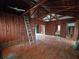 Living room with exposed beams and hardwood floors at 13225 2Nd E St, Madeira Beach, FL 33708