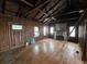 Spacious living room with hardwood floors and wood-beamed ceiling at 13225 2Nd E St, Madeira Beach, FL 33708