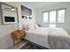 Spacious bedroom with a bed and wooden nightstand at 1515 Pinellas Bayway S # 70, Tierra Verde, FL 33715