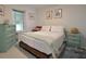 Guest bedroom with light and airy feel, wooden bed frame at 1515 Pinellas Bayway S # 70, Tierra Verde, FL 33715