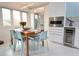 Modern kitchen with stainless steel appliances and light blue cabinets at 1515 Pinellas Bayway S # 70, Tierra Verde, FL 33715