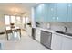 Modern kitchen with stainless steel appliances and light blue cabinets at 1515 Pinellas Bayway S # 70, Tierra Verde, FL 33715