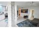 Open living room with grey couch and area rug at 1515 Pinellas Bayway S # 70, Tierra Verde, FL 33715
