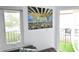 Living area with balcony access and view, comfy seating at 1515 Pinellas Bayway S # 70, Tierra Verde, FL 33715