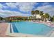 Community pool with plenty of lounge chairs at 1515 Pinellas Bayway S # 70, Tierra Verde, FL 33715