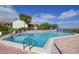 Community pool with plenty of lounge chairs and patio space at 1515 Pinellas Bayway S # 70, Tierra Verde, FL 33715