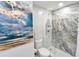 Walk-in shower with frameless glass and marble tile at 1515 Pinellas Bayway S # 70, Tierra Verde, FL 33715