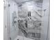 Large walk-in shower with marble-style tile and glass door at 1515 Pinellas Bayway S # 70, Tierra Verde, FL 33715