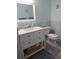 Clean bathroom with white vanity and light blue tile at 1819 Shore S Dr # 203, South Pasadena, FL 33707