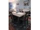 Elegant dining room with a wood table and four chairs at 1819 Shore S Dr # 203, South Pasadena, FL 33707