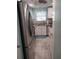 Bright kitchen with stainless steel appliances and white cabinets at 1819 Shore S Dr # 203, South Pasadena, FL 33707