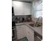 Modern kitchen with granite countertops and stainless steel sink at 1819 Shore S Dr # 203, South Pasadena, FL 33707