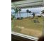 Scenic view of a calm body of water with lush greenery from a window at 1819 Shore S Dr # 203, South Pasadena, FL 33707