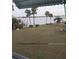 Peaceful waterfront view with boat and lush greenery at 1819 Shore S Dr # 203, South Pasadena, FL 33707
