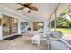 Relaxing screened porch with kitchen views at 2217 Snead Ave, Dunedin, FL 34698