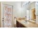 Bathroom with mosaic glass door and vanity at 315 19Th Nw St, Ruskin, FL 33570