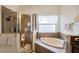 Bathroom with shower, bathtub, and updated tile at 315 19Th Nw St, Ruskin, FL 33570