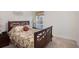 Bedroom with floral bedding and wooden frame bed at 315 19Th Nw St, Ruskin, FL 33570