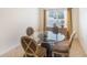 Bright dining room with glass table and four chairs at 315 19Th Nw St, Ruskin, FL 33570
