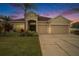 Two-story house with a two-car garage and beautiful landscaping at 315 19Th Nw St, Ruskin, FL 33570