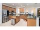 Updated kitchen featuring stainless steel appliances and wood cabinets at 315 19Th Nw St, Ruskin, FL 33570