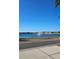 Tranquil lakefront view with fountain and homes in background at 315 19Th Nw St, Ruskin, FL 33570