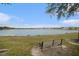 Serene lakefront view with a peaceful park bench at 315 19Th Nw St, Ruskin, FL 33570