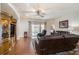 Bright living room with hardwood floors, leather furniture, and access to the backyard pool at 315 19Th Nw St, Ruskin, FL 33570