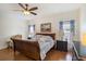 Main bedroom with wood flooring, king-size bed, and plenty of natural light at 315 19Th Nw St, Ruskin, FL 33570
