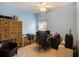 Home office with built-in shelving, desk, and comfortable chair at 315 19Th Nw St, Ruskin, FL 33570