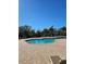 Community pool with lounge chairs and patio area at 315 19Th Nw St, Ruskin, FL 33570