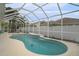 Inviting kidney shaped pool with screened enclosure at 315 19Th Nw St, Ruskin, FL 33570